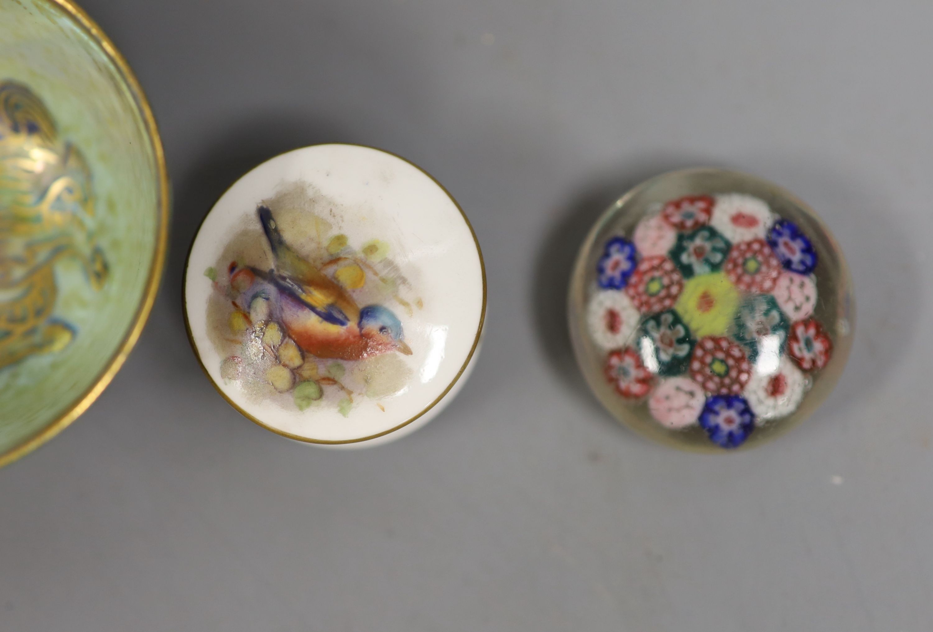 A Wedgwood lustre small cup, 4cm high, two Royal Worcester 'bird' pots & covers and three glass millefiori paperweights.